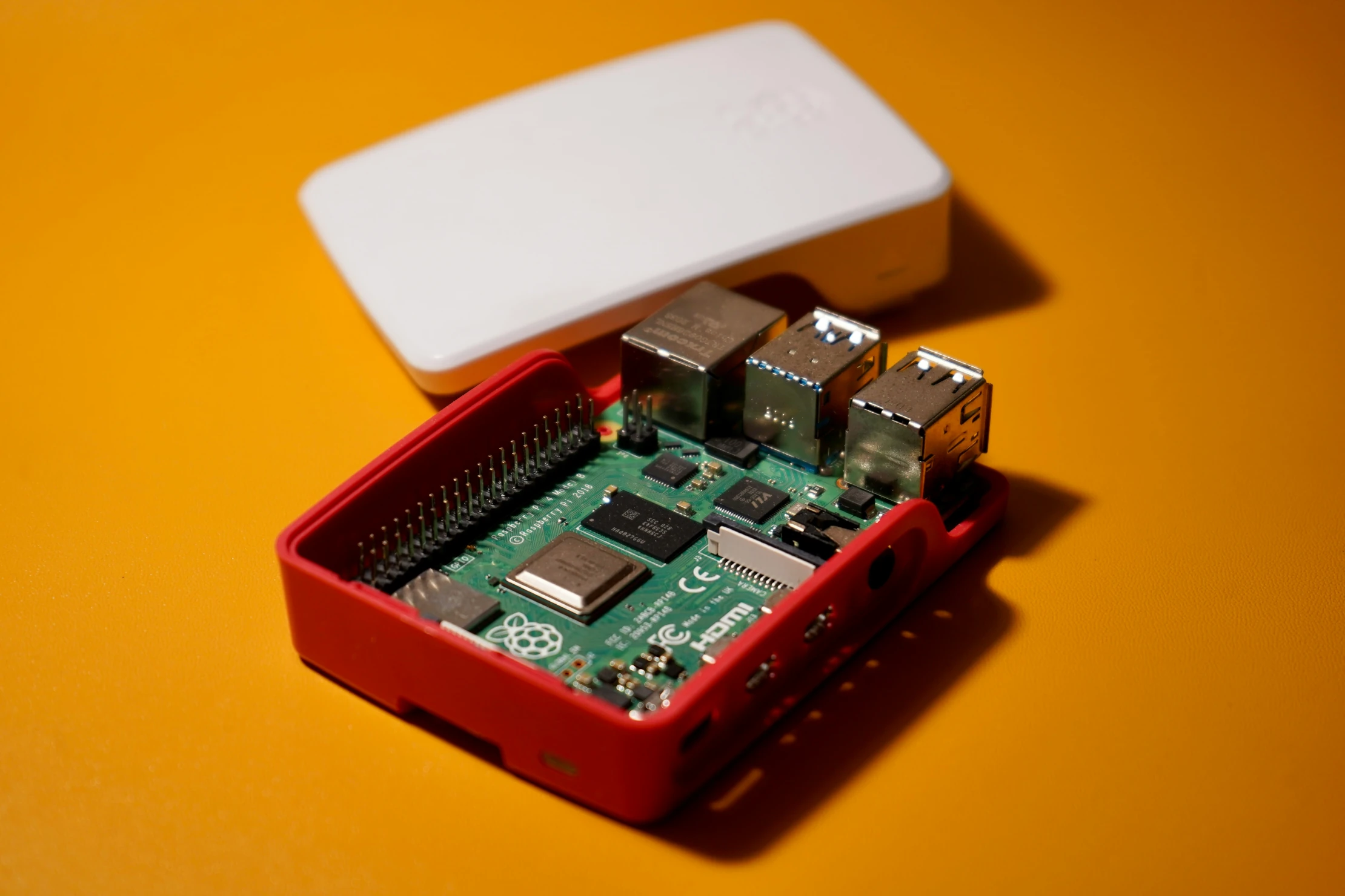 MapTiler image raspberry-pi-on-orange-background.webp